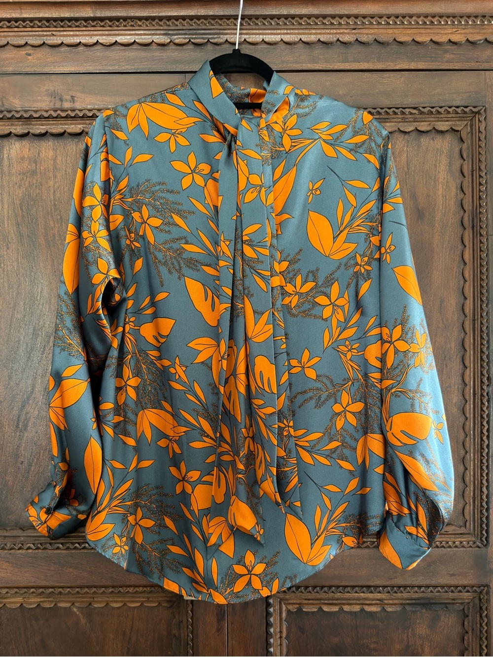 Zara Woman Orange Floral Blouse on Teal Background